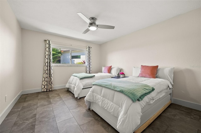 tiled bedroom featuring ceiling fan