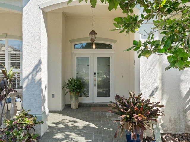 property entrance featuring french doors