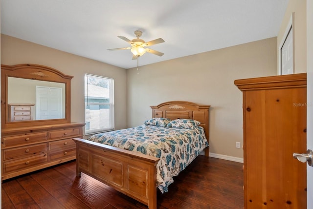 bedroom featuring dark wood-type flooring and ceiling fan