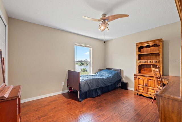 bedroom featuring dark wood-type flooring and ceiling fan