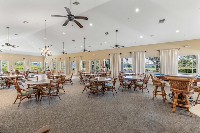 dining area featuring a wealth of natural light, high vaulted ceiling, ceiling fan, and carpet flooring