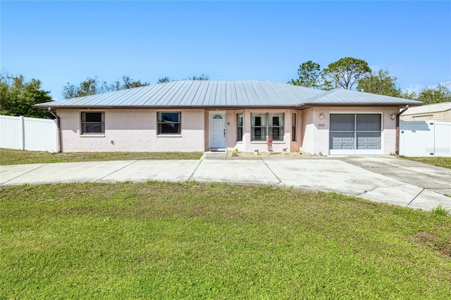 single story home with a garage and a front yard