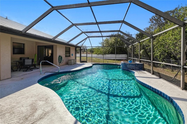 view of swimming pool featuring a patio area and glass enclosure