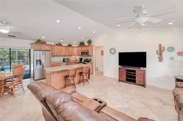 living room with lofted ceiling and ceiling fan