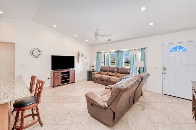 living room featuring vaulted ceiling and ceiling fan