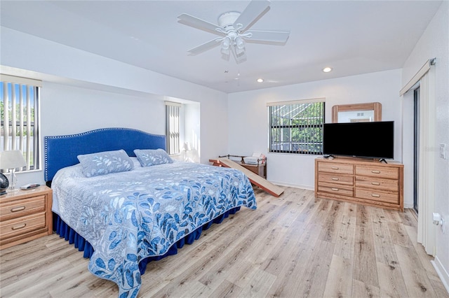 bedroom featuring ceiling fan and light hardwood / wood-style flooring