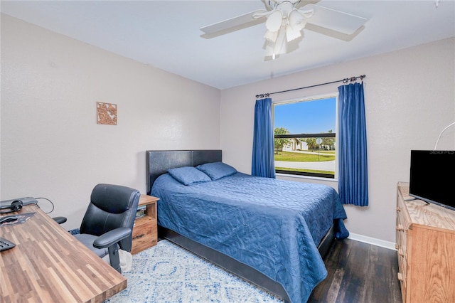 bedroom featuring dark wood-type flooring and ceiling fan