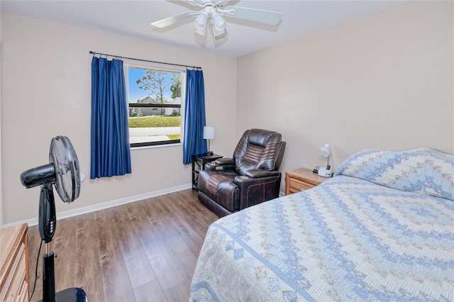 bedroom with hardwood / wood-style floors and ceiling fan