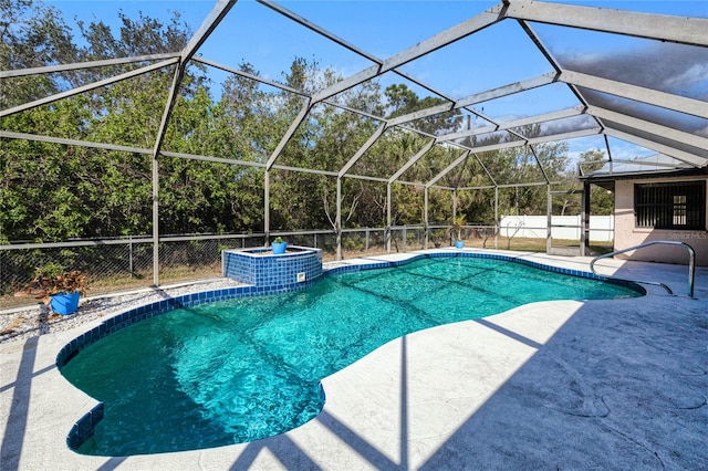 view of pool with a lanai and a patio area