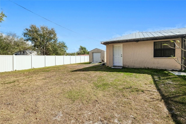 view of yard with a garage