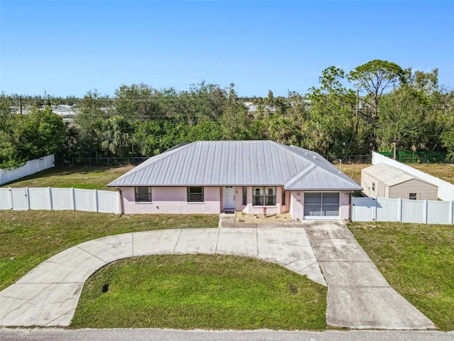 view of front of house with a garage and a front yard