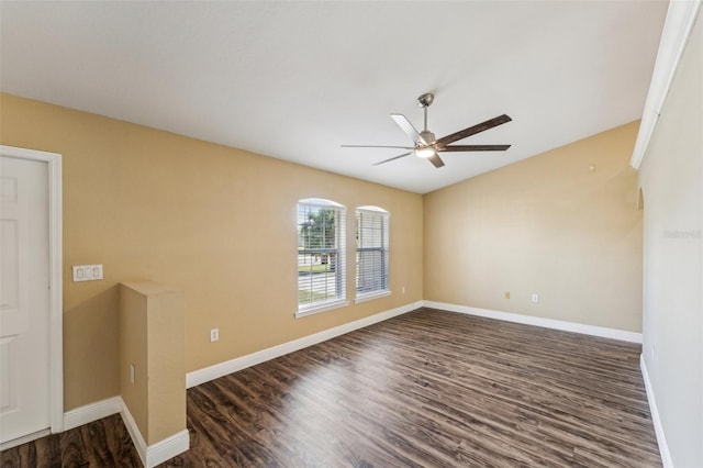 empty room with dark hardwood / wood-style floors and ceiling fan