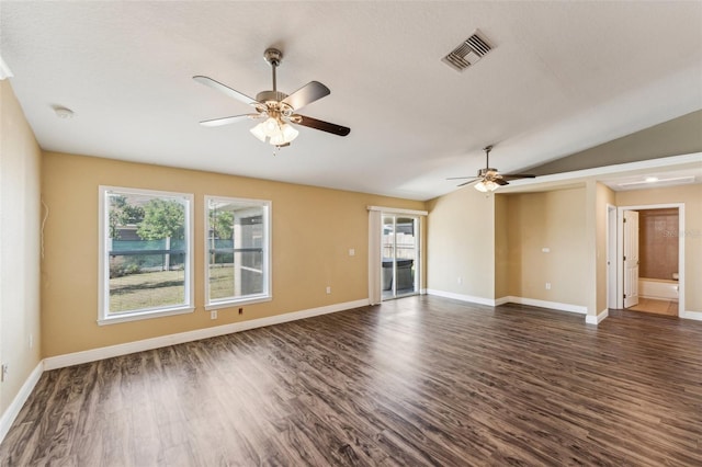 unfurnished living room featuring ceiling fan, dark hardwood / wood-style flooring, and vaulted ceiling