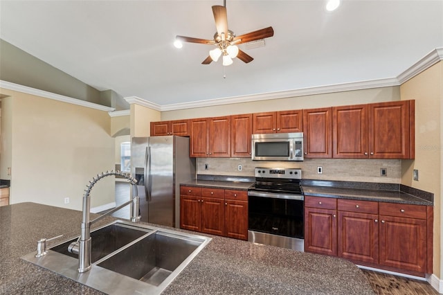 kitchen featuring sink, decorative backsplash, ornamental molding, ceiling fan, and stainless steel appliances