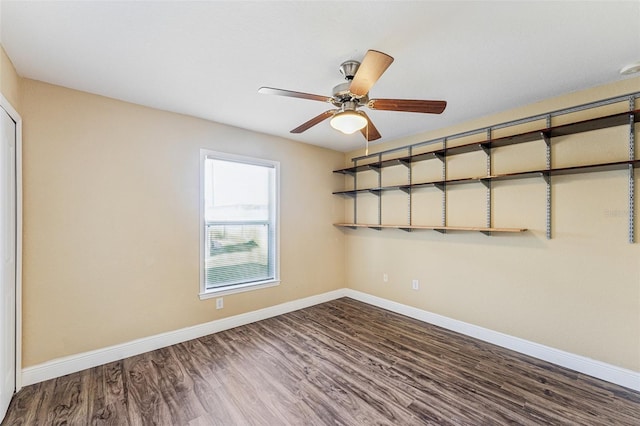 empty room featuring ceiling fan and hardwood / wood-style floors