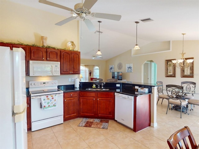 kitchen featuring light tile patterned floors, white appliances, decorative light fixtures, and kitchen peninsula