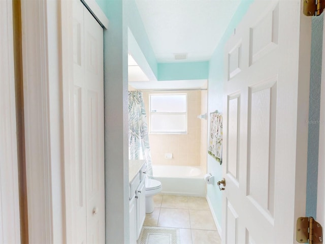 bathroom featuring tile patterned floors, toilet, and vanity