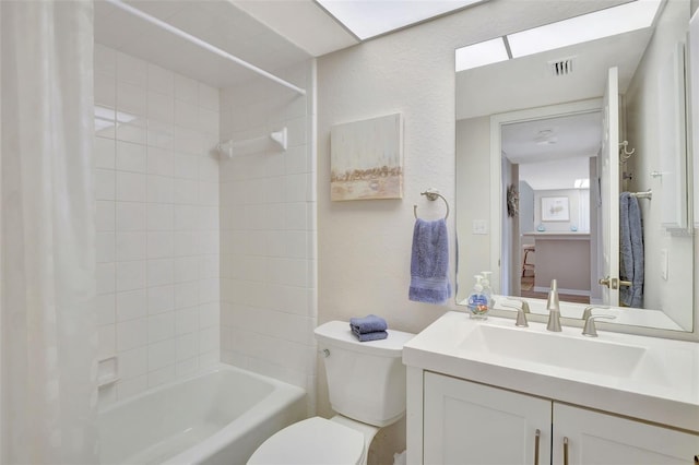 full bathroom with toilet, vanity, and shower / bath combo with shower curtain