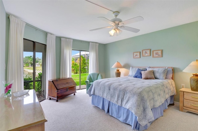 bedroom with light carpet, ceiling fan, and access to outside