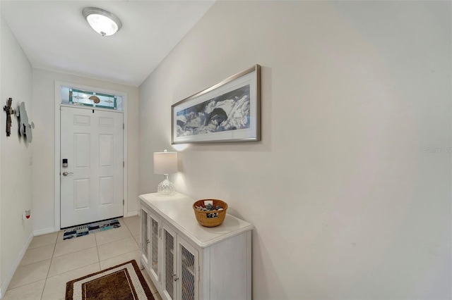 foyer entrance featuring light tile patterned flooring