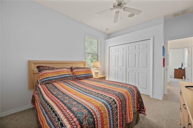 bedroom with light carpet, a closet, and ceiling fan