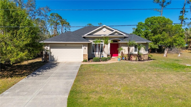 view of front of house featuring a front yard and a garage