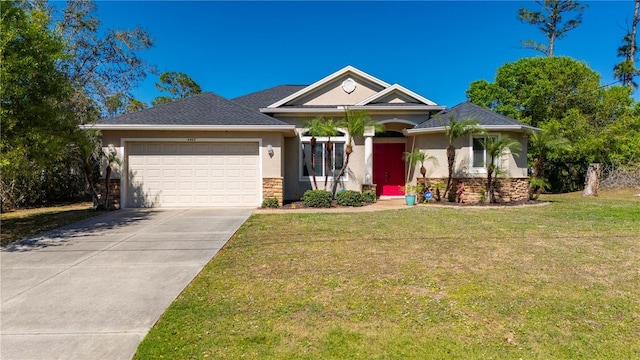 view of front of home with a front lawn and a garage