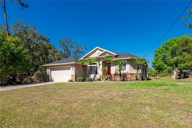 view of front facade with a front yard and a garage