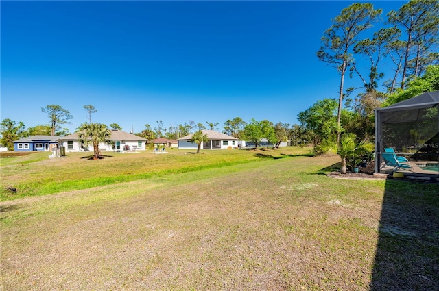 view of yard featuring a lanai