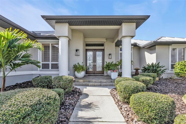 property entrance featuring french doors