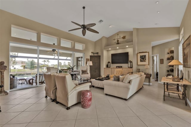 tiled living room featuring ceiling fan and high vaulted ceiling