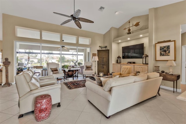 living room with ceiling fan, high vaulted ceiling, and light tile patterned floors