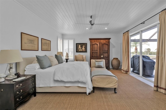 bedroom featuring multiple windows, wooden ceiling, and access to exterior