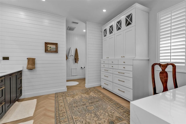 bathroom featuring vanity and parquet flooring