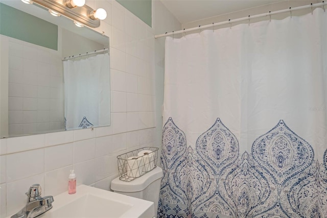 11369 1st Ave, Punta Gorda, FL 33955 - bathroom with tasteful backsplash, vanity, tile walls, and toilet