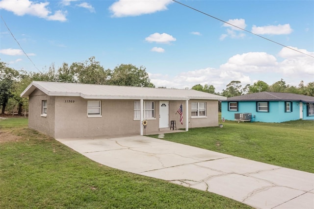 11369 1st Ave, Punta Gorda, FL 33955 - ranch-style house with a front yard and central air condition unit