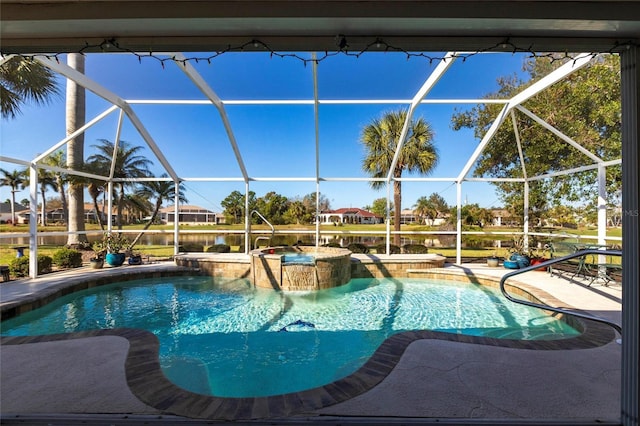 view of pool featuring an in ground hot tub, a lanai, and a patio