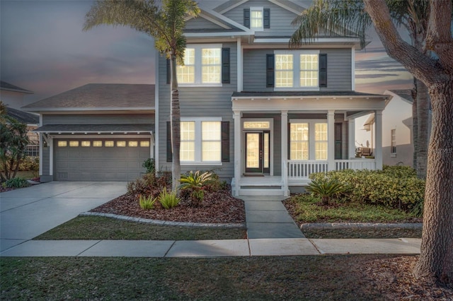 traditional home with driveway and an attached garage