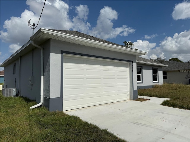 view of home's exterior with a garage and central AC