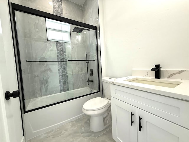 full bathroom featuring toilet, vanity, and bath / shower combo with glass door