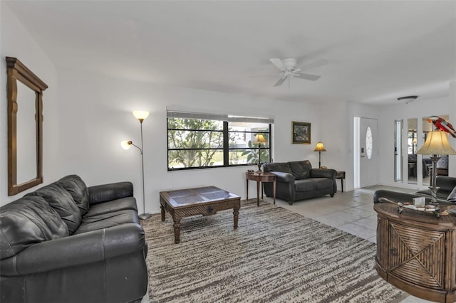 tiled living room with ceiling fan