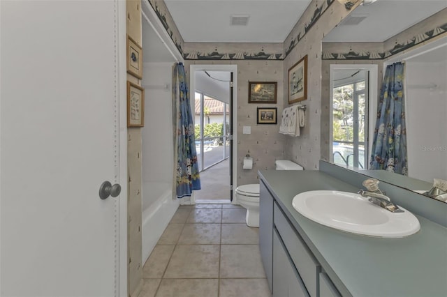 full bathroom with shower / bathtub combination with curtain, vanity, toilet, and tile patterned flooring