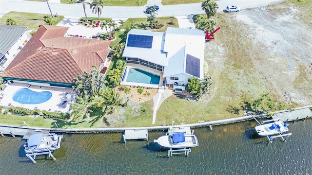 drone / aerial view with a water view