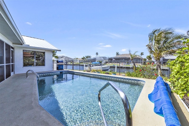 view of pool featuring a water view