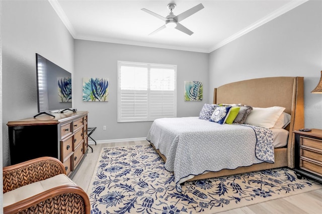 bedroom with ceiling fan, ornamental molding, and light wood-type flooring