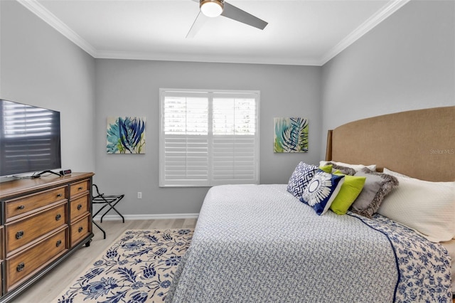 bedroom featuring crown molding, ceiling fan, and light hardwood / wood-style flooring