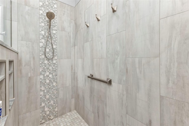 bathroom featuring tiled shower