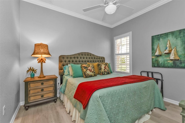 bedroom with ceiling fan, ornamental molding, and wood-type flooring