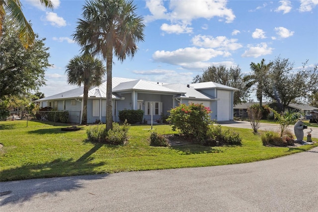 ranch-style home with a front lawn