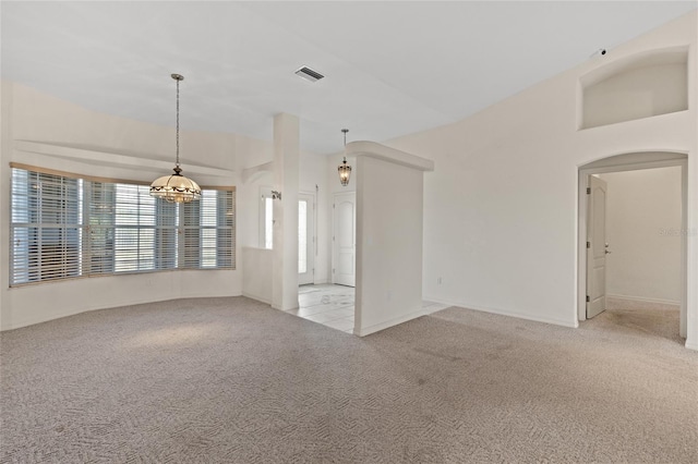 unfurnished living room featuring light colored carpet